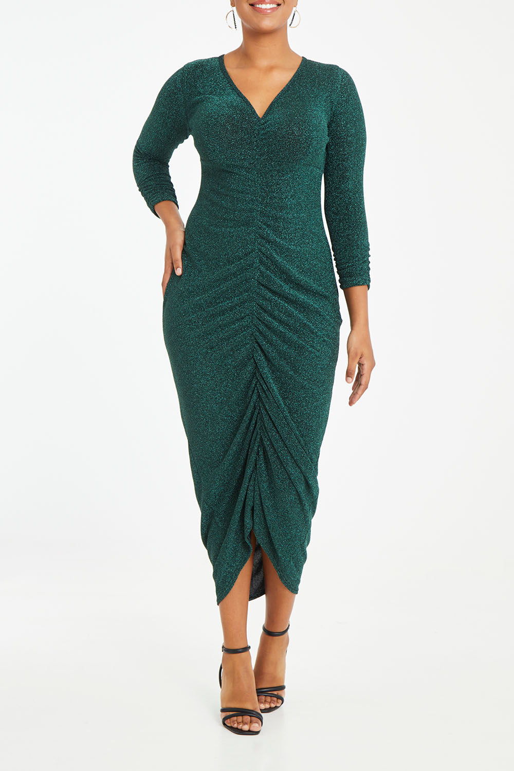 Model Noli wearing size 14 of the Carolyn Dress in colour Forest (Green), from the front, cropped image