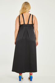 Model Katie wearing size 16 of the Carla Dress in colour Black (Black), from the back