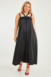 Model Katie wearing size 16 of the Carla Dress in colour Black (Black), from the front, showing the whole outfit