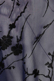 Product shot of the Penny Shrug in colour Navyfleur (Blue), detail