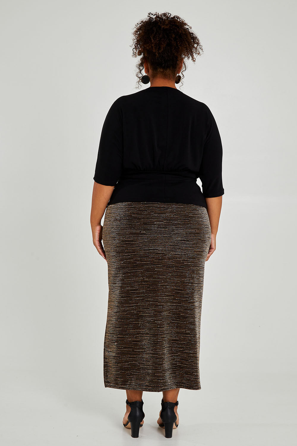 Model Alexis wearing size 16 of the Niamh Top in colour Black (Black), from the back