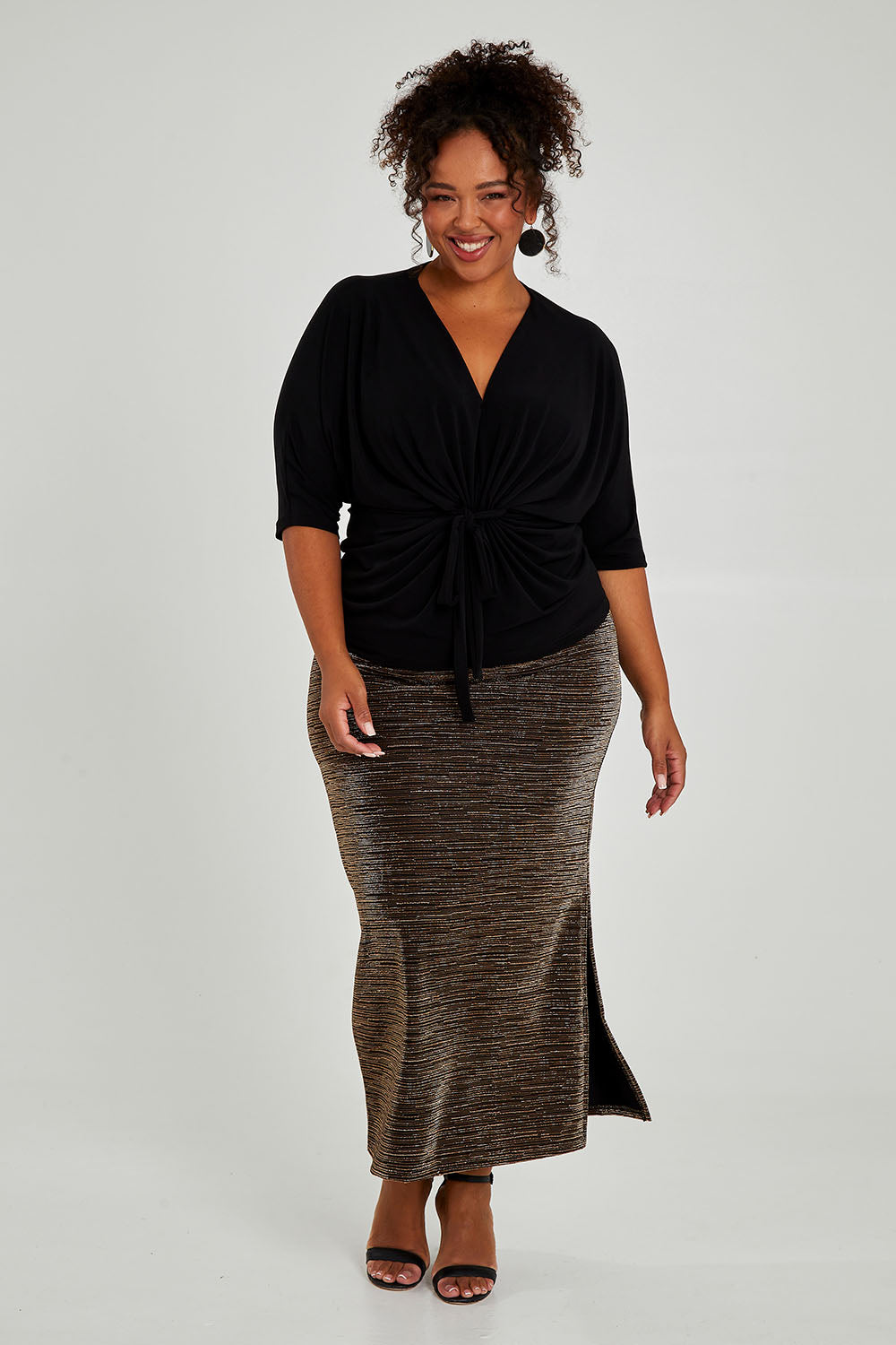 Model Alexis wearing size 16 of the Niamh Top in colour Black (Black), from the front, showing the whole outfit