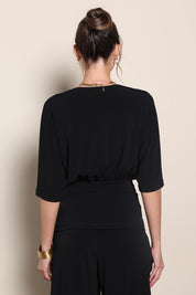 Model Maddiec wearing size 10 of the Niamh Top - Black in colour Black, from the back