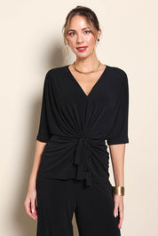Model Maddiec wearing size 10 of the Niamh Top - Black in colour Black, in a cropped view