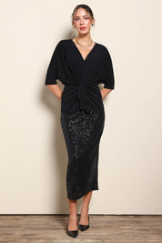 Model Maddiec wearing size 10 of the Niamh Top - Black in colour Black, from the front