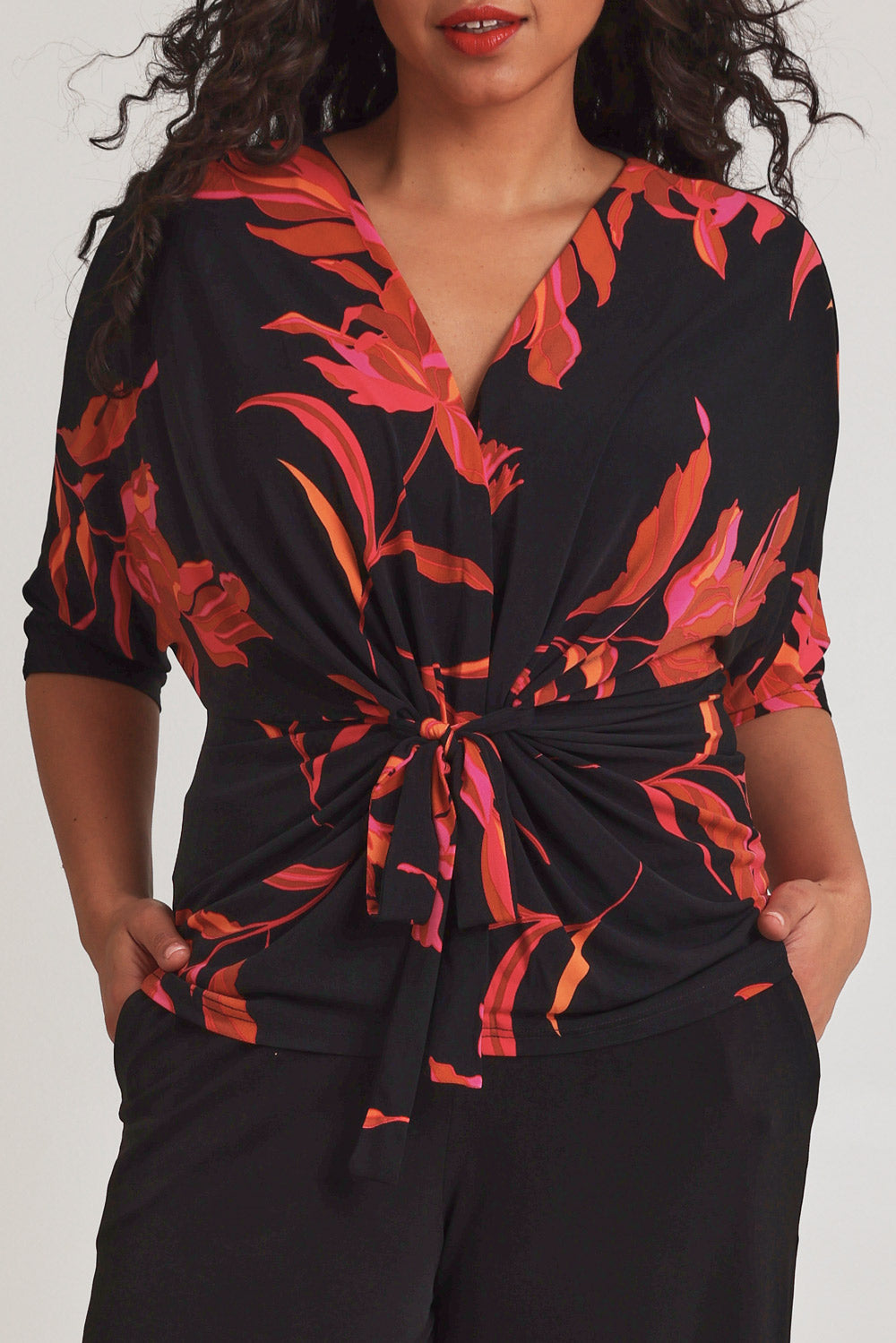 Model Terri-Leigh wearing size 14 of The Printed Niamh Top in colour Firelight (Black), from the front, cropped image