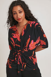 Model Terri-Leigh wearing size 14 of The Printed Niamh Top in colour Firelight (Black), from the front, cropped image
