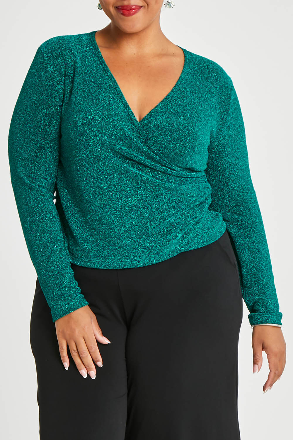 Model Alexis wearing size 16 of the Charlotte Top in colour Jade (Green), from the front, cropped image