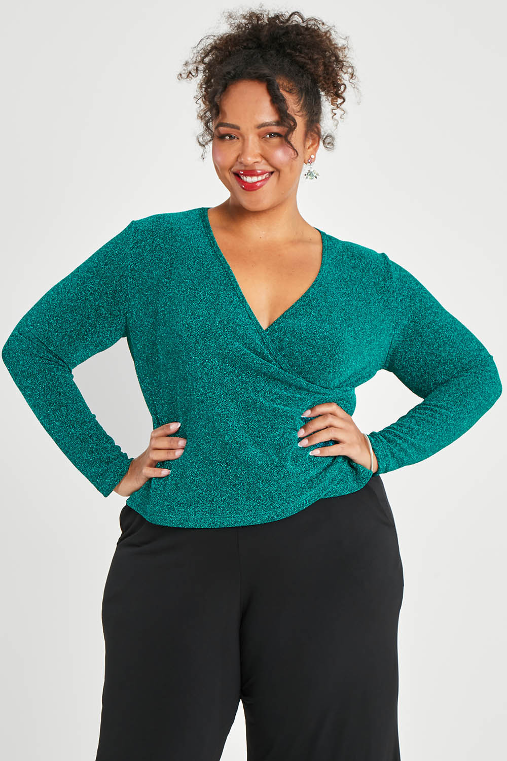 Model Alexis wearing size 16 of the Charlotte Top in colour Jade (Green), from the front, cropped image
