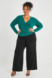 Model Alexis wearing size 16 of the Charlotte Top in colour Jade (Green), from the front, showing the whole outfit