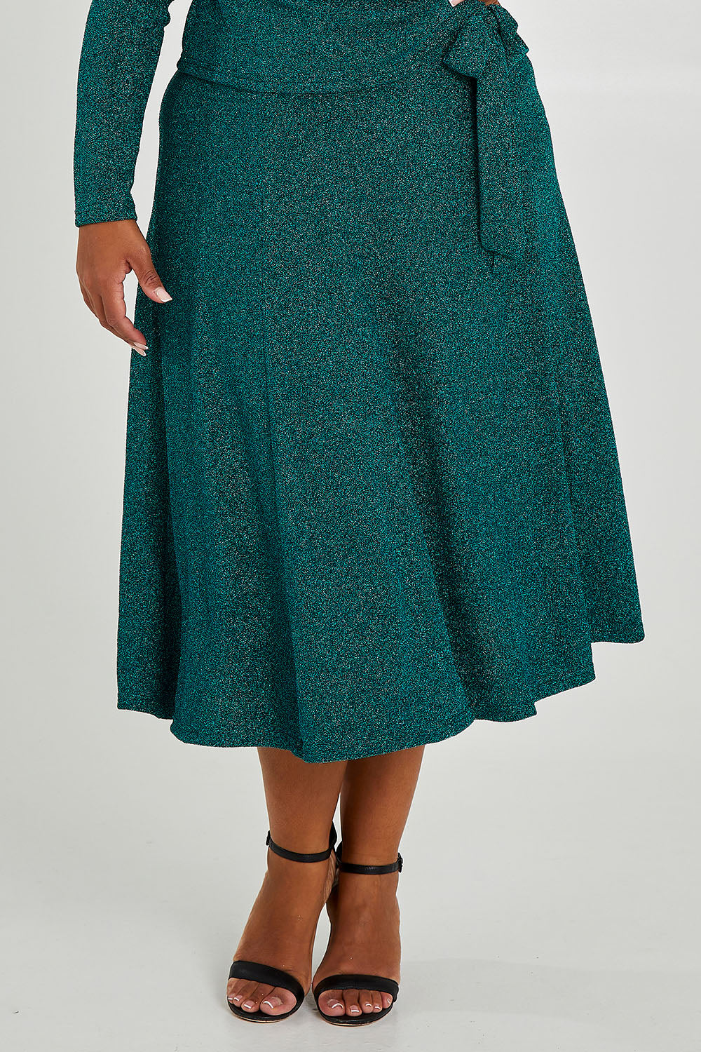 Model Alexis wearing size 16 of the Karen Skirt in colour Jade (Green), from the front, cropped image