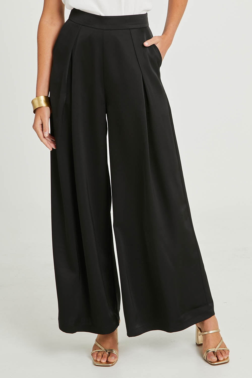 Model Madeline wearing size 10 of the Mandy Pants in colour Black (Black), from the front, cropped image