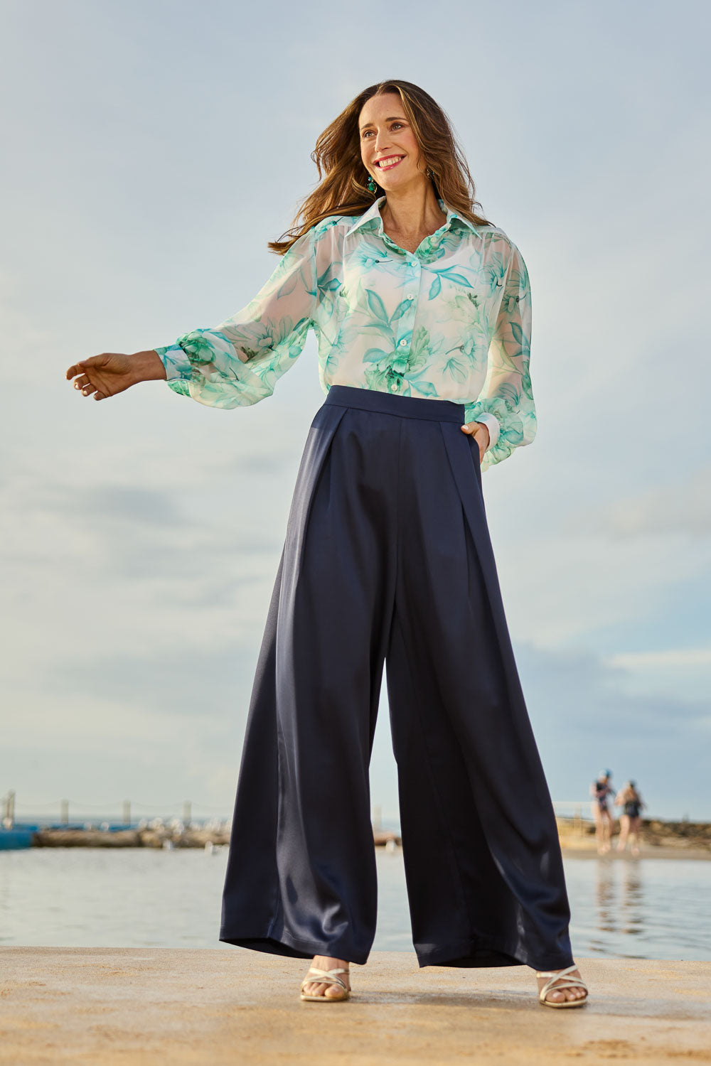 Model Clementine wearing size 10 of the Mandy Pants in colour Navy (Blue), from the front, showing the whole outfit