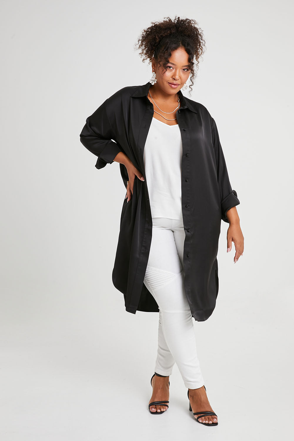 Model Alexis wearing size 16 of the Mandy Shirt in colour Black (Black), from the front, showing the whole outfit