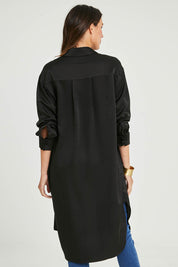 Model Madeline wearing size 10 of the Mandy Shirt in colour Black (Black), from the back