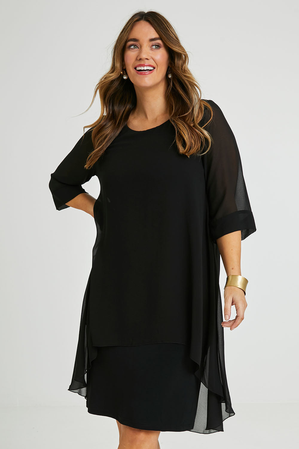 Model Laura wearing size 14 of the Bethany Dress in colour Black (Black), from the front, cropped image