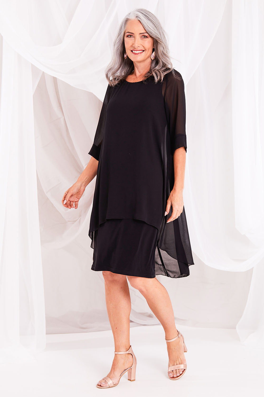Model Luisa wearing size 10 of the Bethany Dress in colour Black (Black), from the front, showing the whole outfit