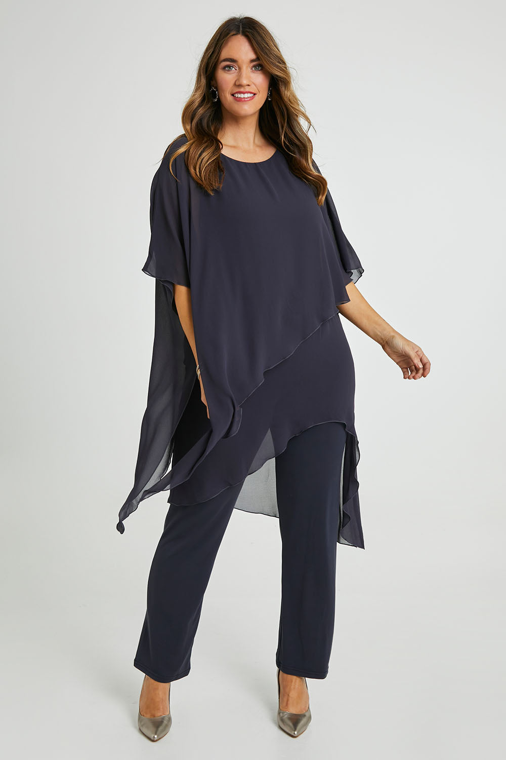 Model Laura wearing size 14 of the Sandy Jumpsuit in colour Charcoal (Grey), from the front, showing the whole outfit