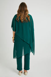 Model Laura wearing size 14 of the Sandy Jumpsuit in colour Pine (Green), from the back