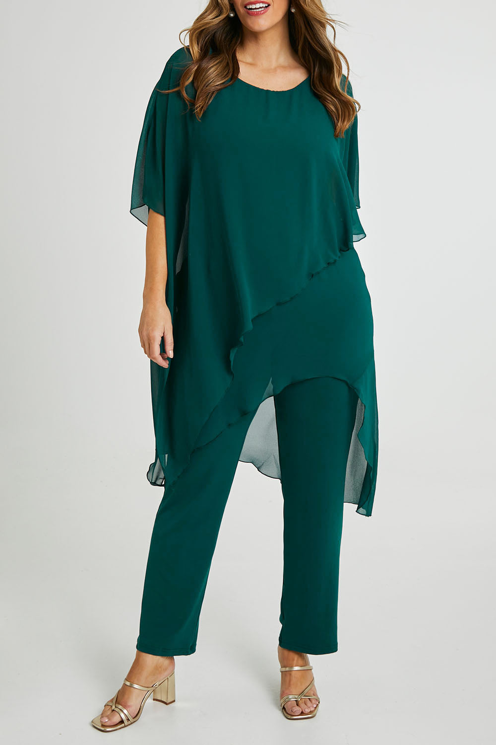 Model Laura wearing size 14 of the Sandy Jumpsuit in colour Pine (Green), from the front, cropped image