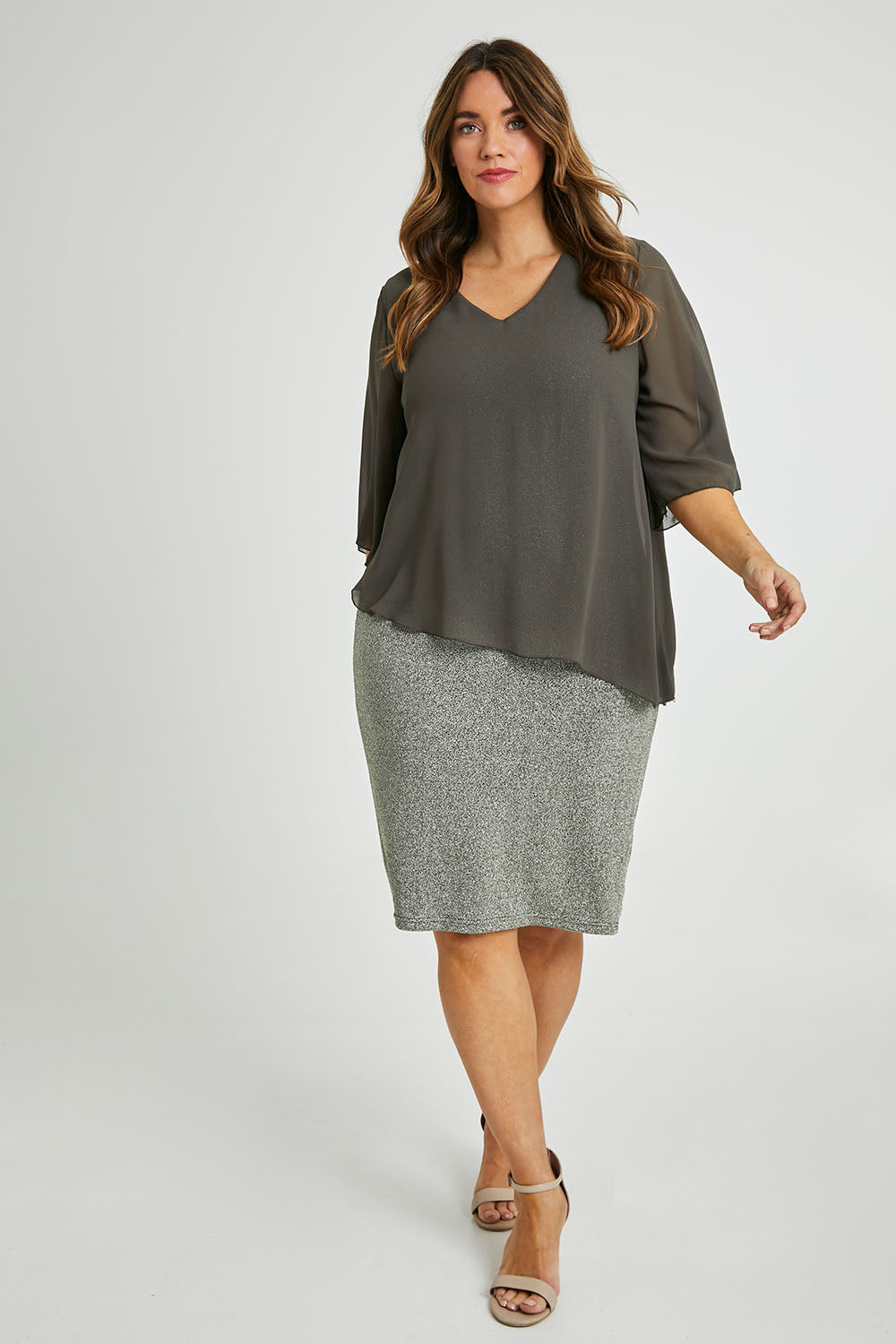 Model Laura wearing size 14 of the Bridgette Dress in colour Khakisilv (Green), from the front, showing the whole outfit