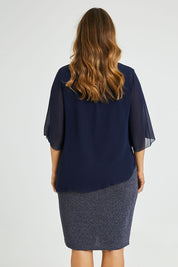 Model Laura wearing size 14 of the Bridgette Dress in colour Navy (Blue), from the back