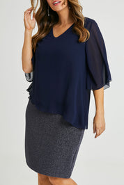 Model Laura wearing size 14 of the Bridgette Dress in colour Navy (Blue), from the front, cropped image