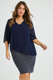 Model Laura wearing size 14 of the Bridgette Dress in colour Navy (Blue), from the front, cropped image