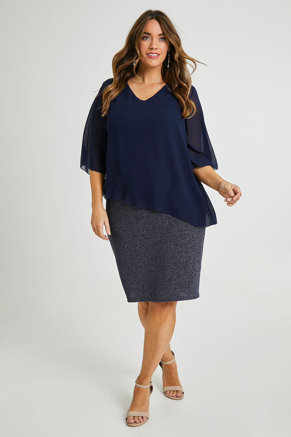 Model Laura wearing size 14 of the Bridgette Dress in colour Navy (Blue), from the front, showing the whole outfit