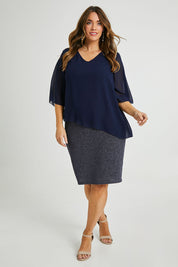 Model Laura wearing size 14 of the Bridgette Dress in colour Navy (Blue), from the front, showing the whole outfit