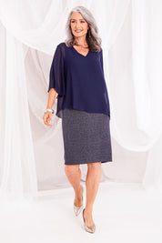 Model Luisa wearing size 10 of the Bridgette Dress in colour Navy (Blue), from the front, showing the whole outfit
