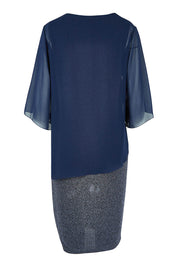 Product shot of the Bridgette Dress in colour Navy (Blue), from the back