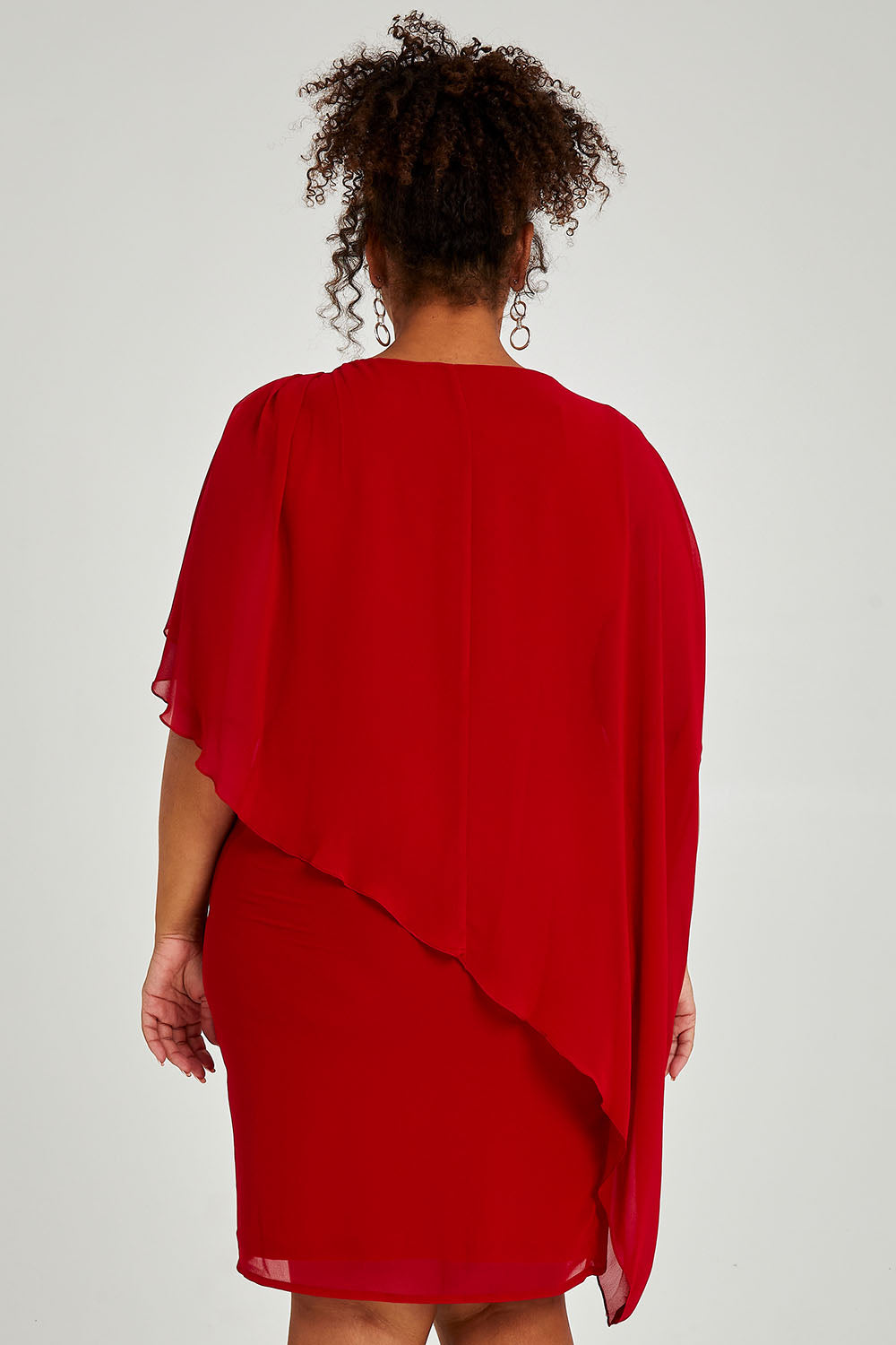 Model Alexis wearing size 16 of the Beatrice Dress in colour Red (Red), from the back