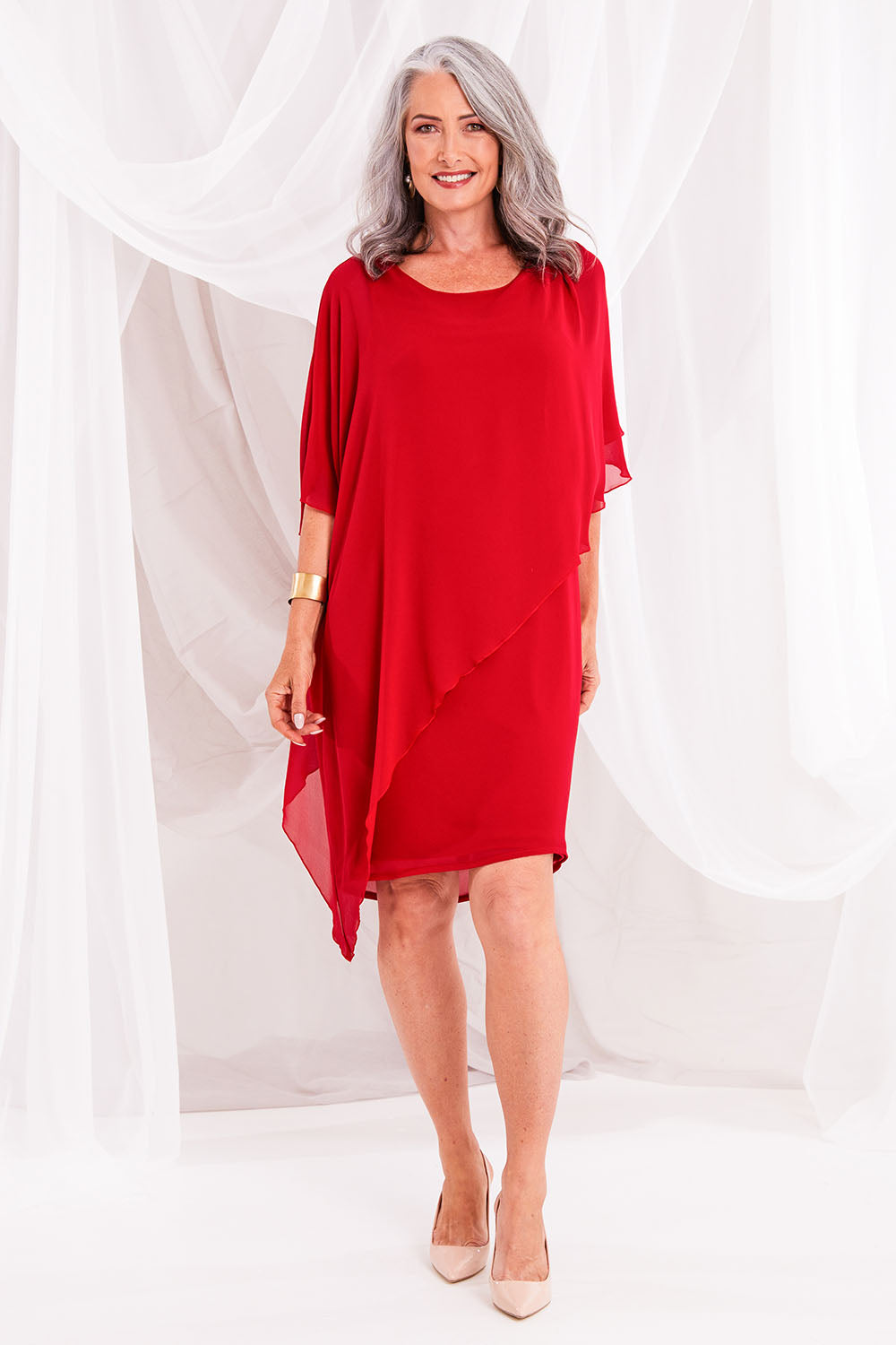 Model Luisa wearing size 10 of the Beatrice Dress in colour Red (Red), from the front, showing the whole outfit