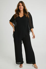 Model Laura wearing size 14 of the Marie Pants in colour Black (Black), from the front, showing the whole outfit