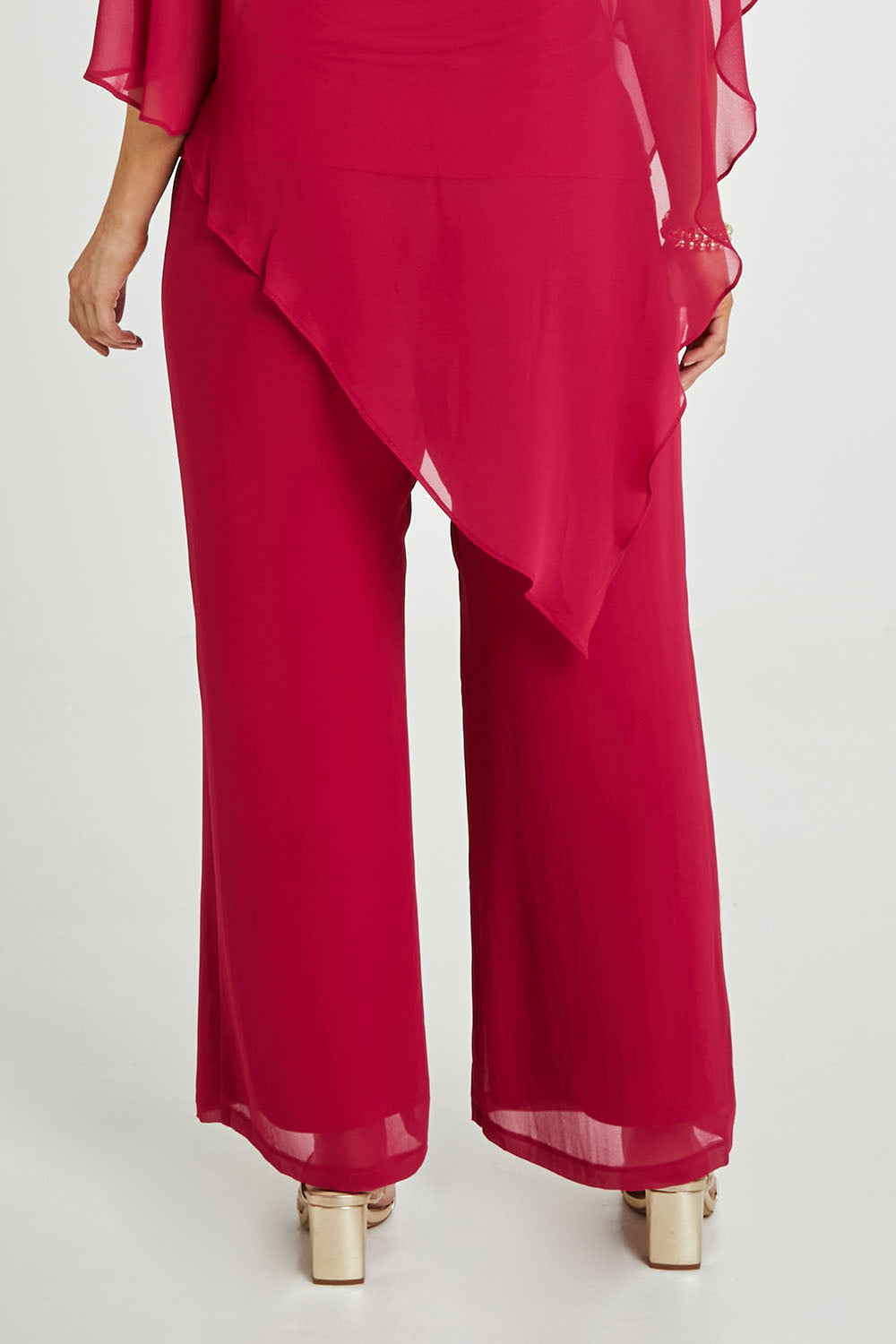 Model Laura wearing size 14 of the Marie Pants in colour Granita (Pink), from the back