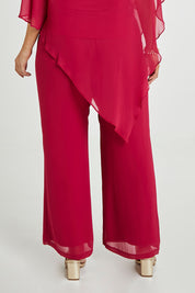 Model Laura wearing size 14 of the Marie Pants in colour Granita (Pink), from the back