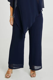 Model Laura wearing size 14 of the Marie Pants in colour Navy (Blue), from the front, cropped image