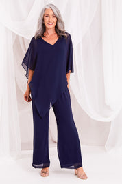 Model Luisa wearing size 10 of the Marie Pants in colour Navy (Blue), from the front, showing the whole outfit