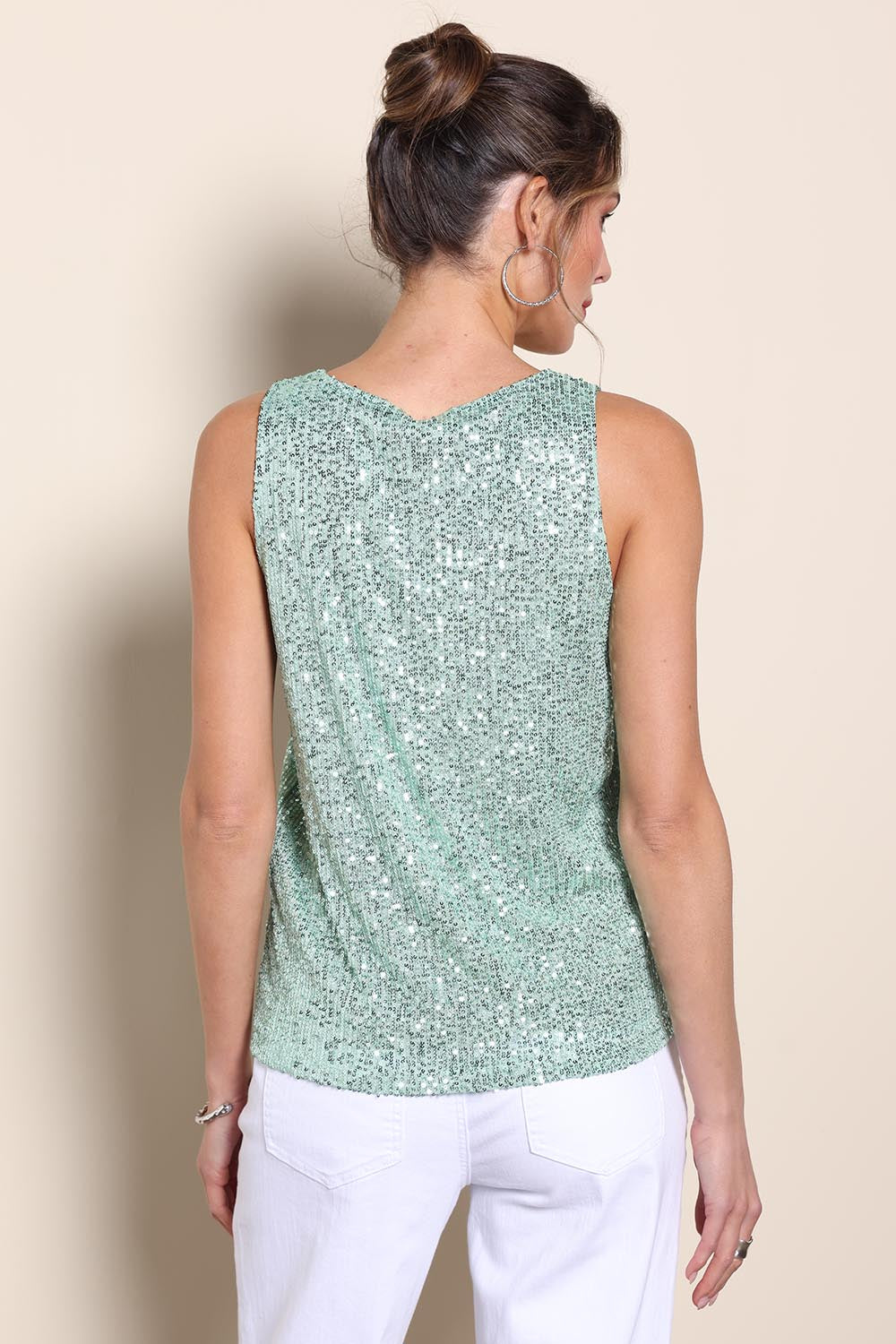 Model Maddiec wearing size 10 of the Reece Sequin Top – Mint in colour Mint, from the back