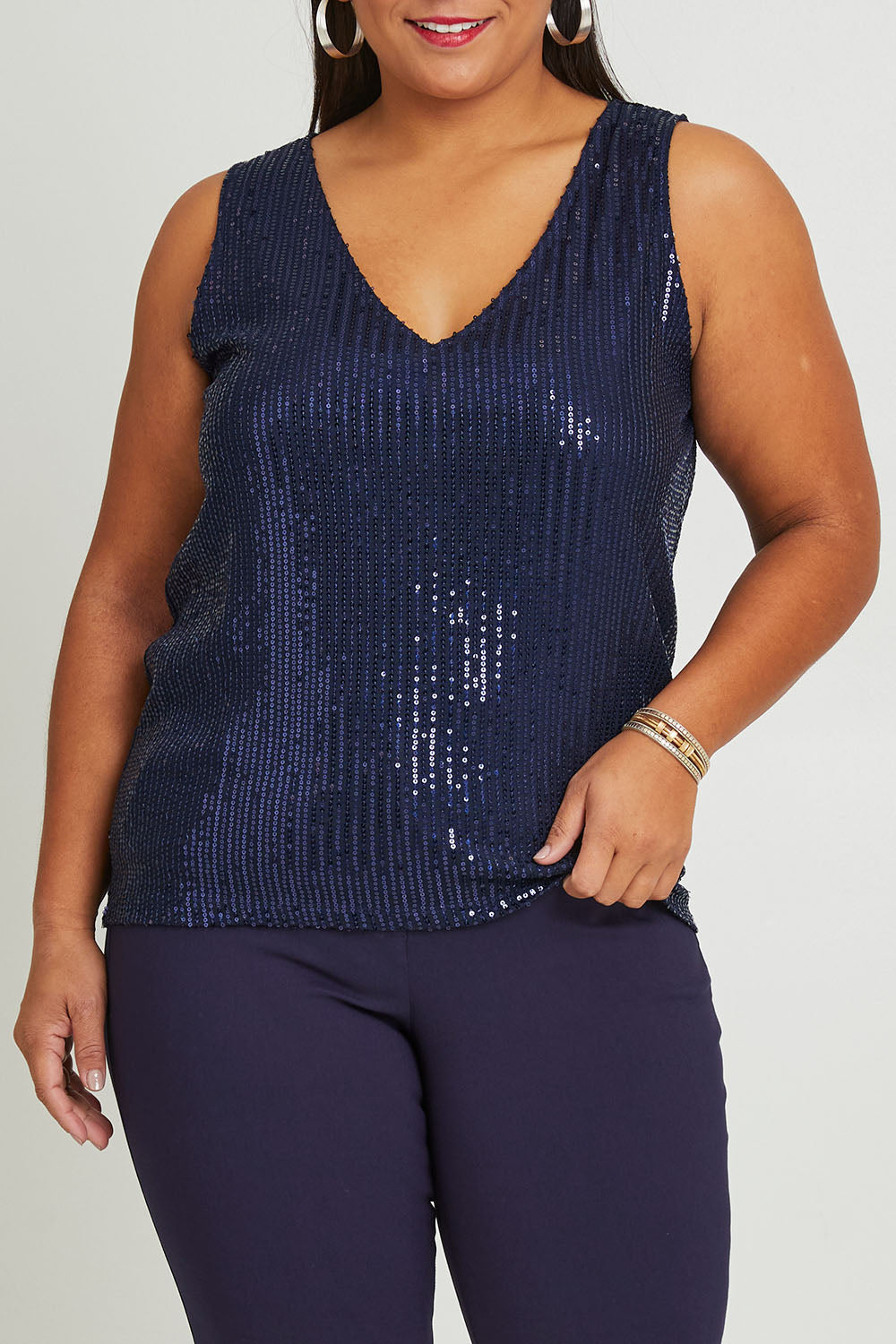 Model Ashleigh wearing size 16 of the Reece Top in colour Navy (Blue), from the front, cropped image