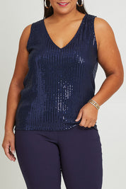 Model Ashleigh wearing size 16 of the Reece Top in colour Navy (Blue), from the front, cropped image