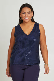 Model Ashleigh wearing size 16 of the Reece Top in colour Navy (Blue), from the front, cropped image