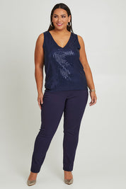 Model Ashleigh wearing size 16 of the Reece Top in colour Navy (Blue), from the front, showing the whole outfit