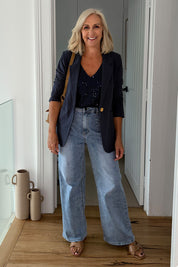 Model Sandy wearing size 10 of the Reece Top in colour Navy (Blue), from the front, showing the whole outfit
