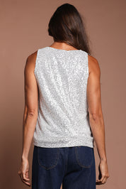Model Amanda wearing size 10 of the Reece Top in colour Silver (Metallics), from the back