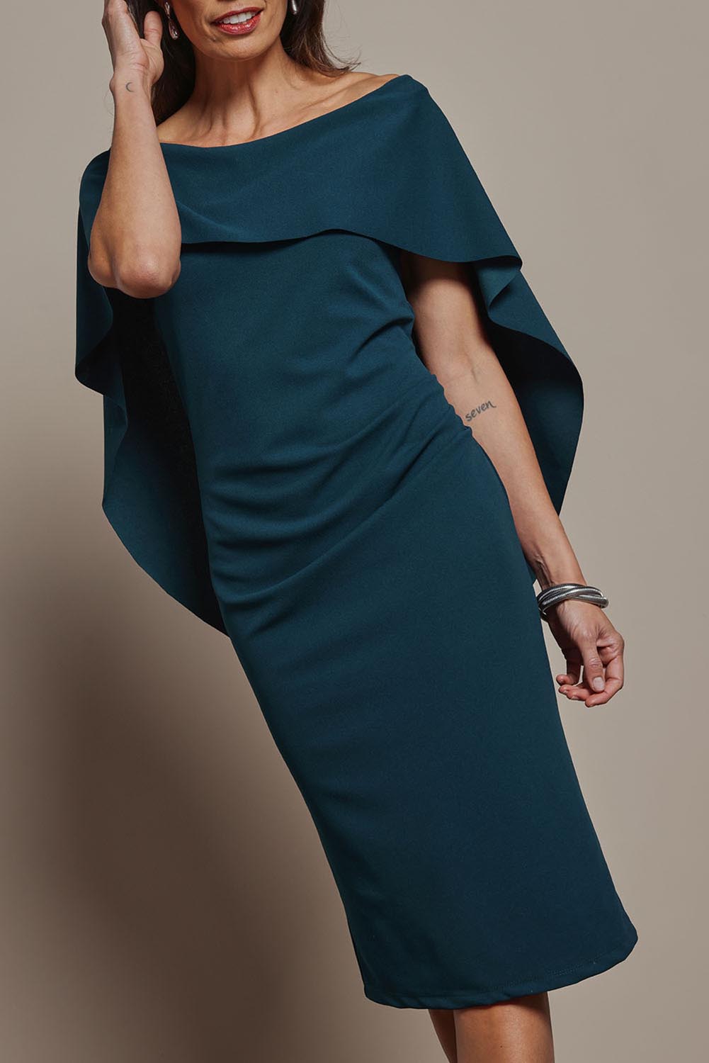 Model Amanda wearing size 10 of the Cora Dress in colour Darkteal (Green), from the front, cropped image