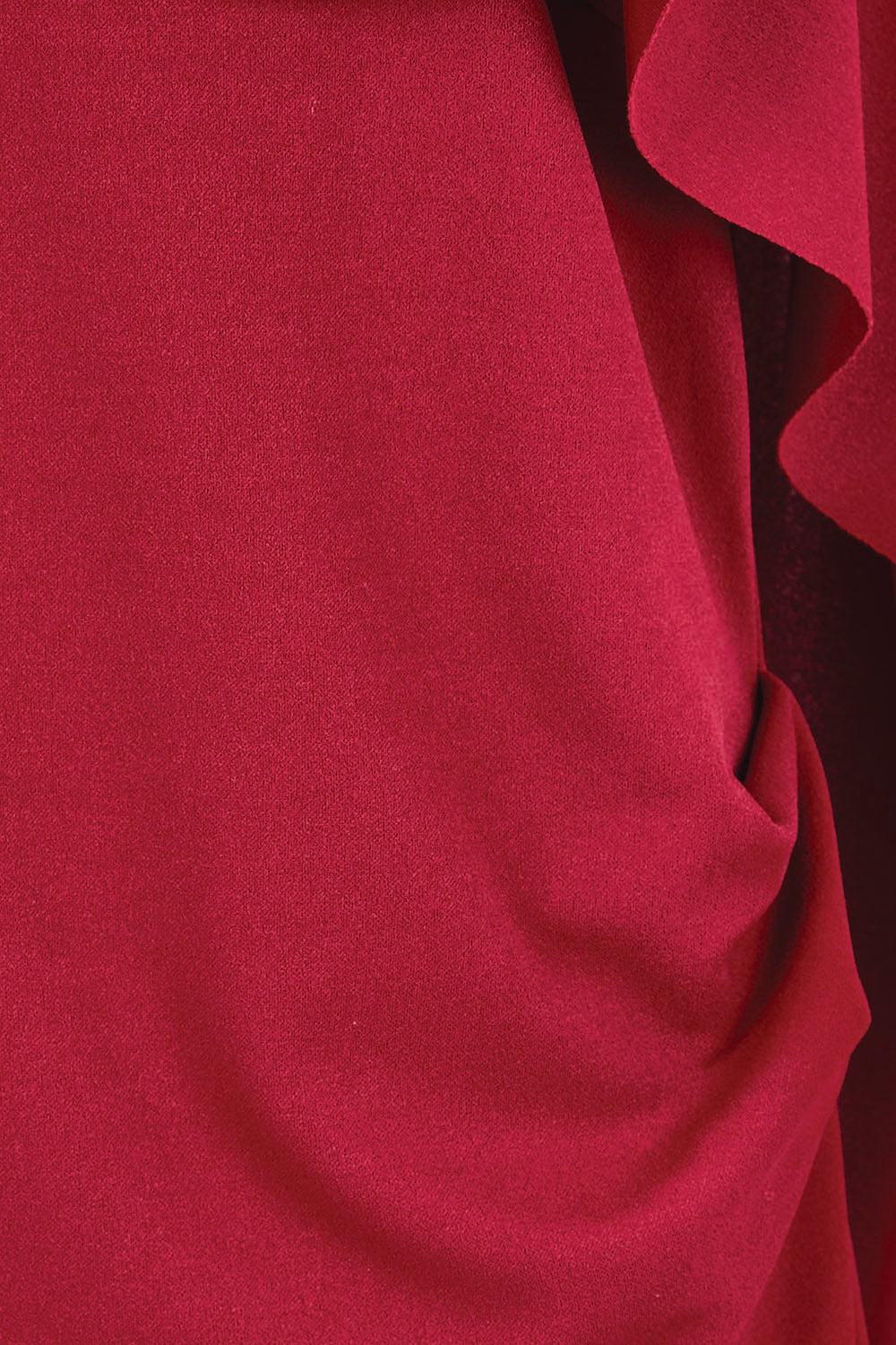 Product shot of the Cora Dress – Garnet in colour Garnet, showing detail