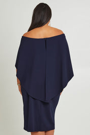 Model Ashleigh wearing size 16 of the Cora Dress in colour Navy (Blue), from the back