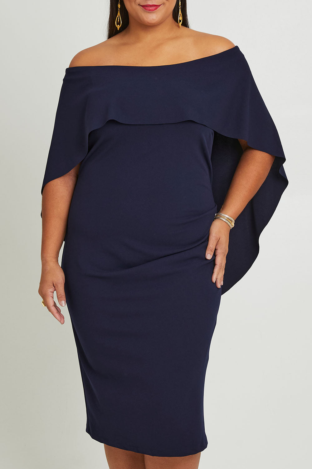 Model Ashleigh wearing size 16 of the Cora Dress in colour Navy (Blue), from the front, cropped image